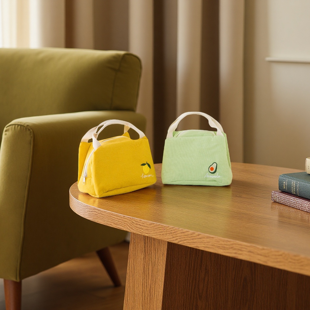There are two fashionable options available: a yellow lemon pattern handbag and a green avocado pattern handbag details Picture