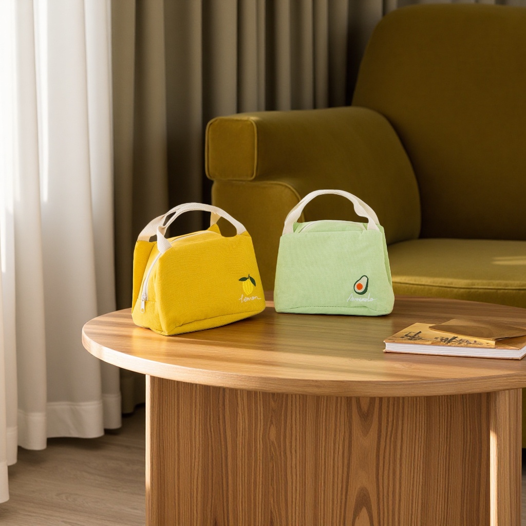 There are two fashionable options available: a yellow lemon pattern handbag and a green avocado pattern handbag full image