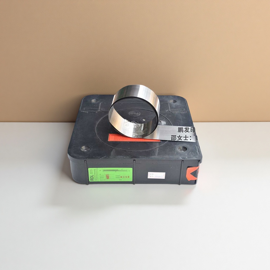 A set of manual ink printing tools with a black plastic box and metal roller for printing equipment