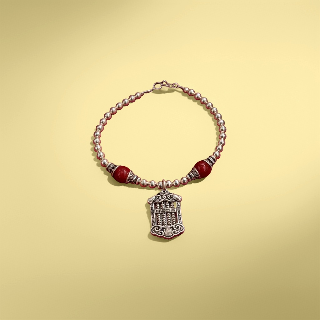 A silver necklace in a red velvet box