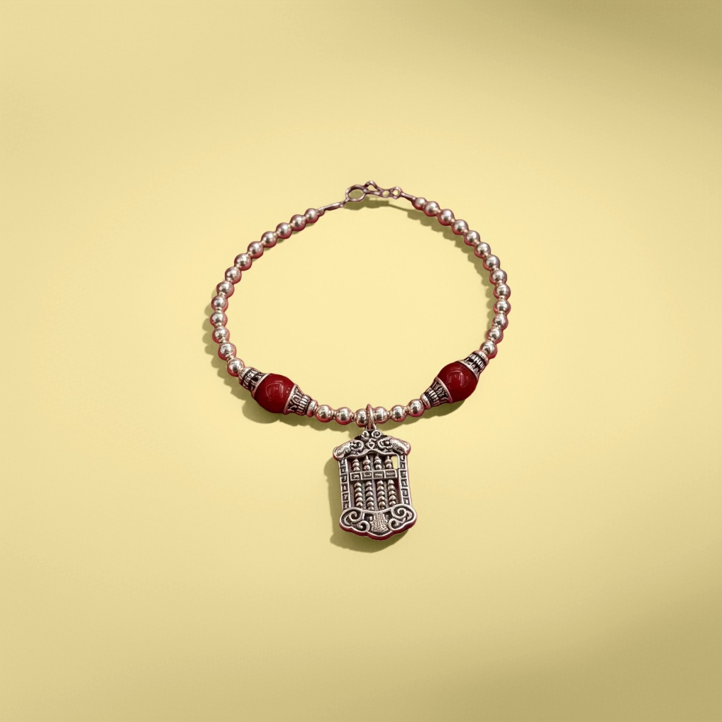 A silver necklace in a red velvet box details Picture