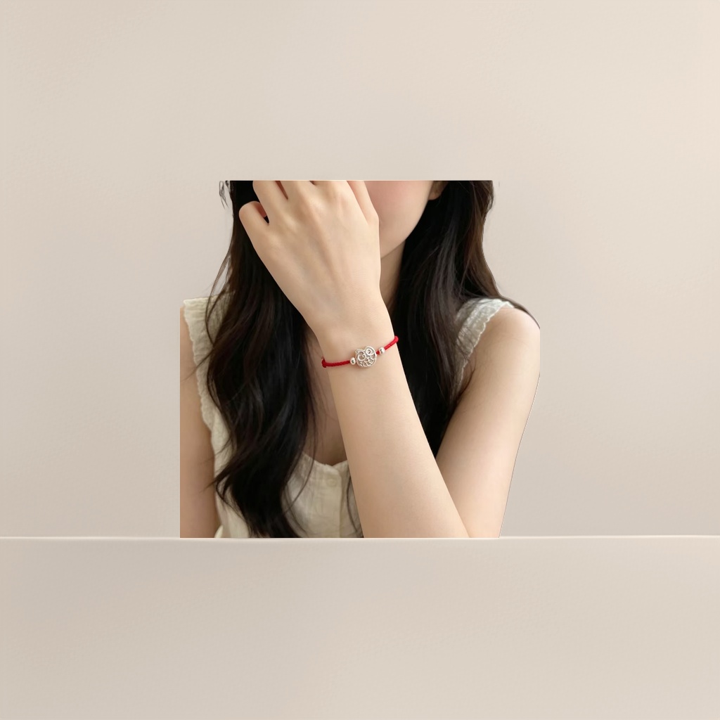 A fashionable and simple couple's style with a red rope bracelet and a silver owl pendant Specification image