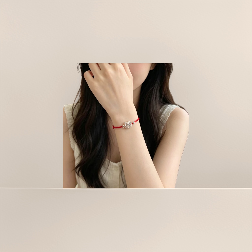 A fashionable and simple couple's style with a red rope bracelet and a silver owl pendant Application Scenario