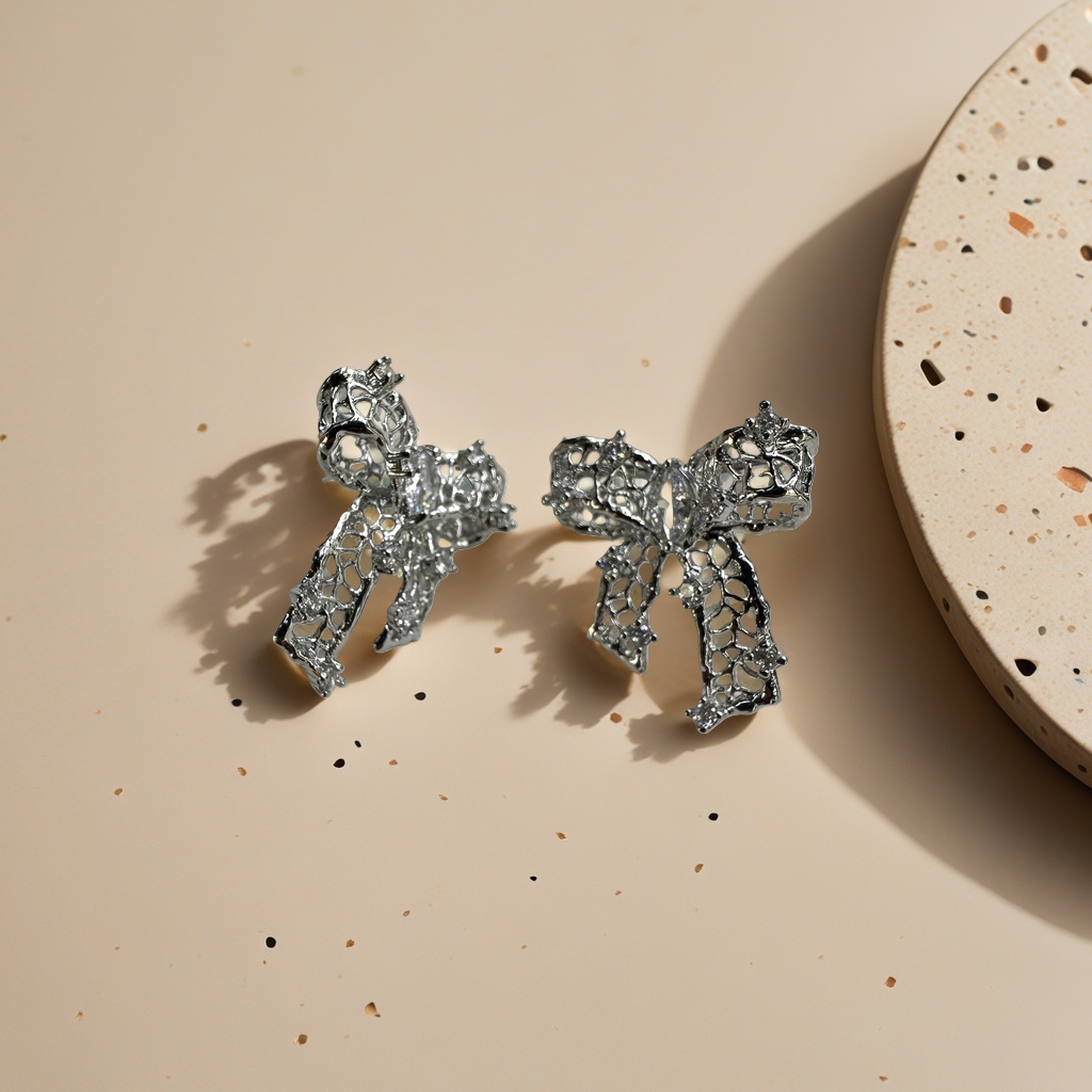 Silver hollowed-out bow stud earrings are fashionable, simple and versatile earrings Specification image