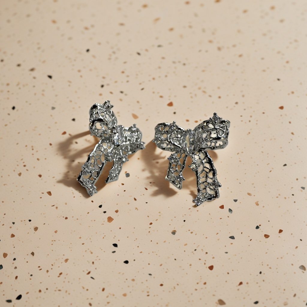 Silver hollowed-out bow stud earrings are fashionable, simple and versatile earrings details Picture