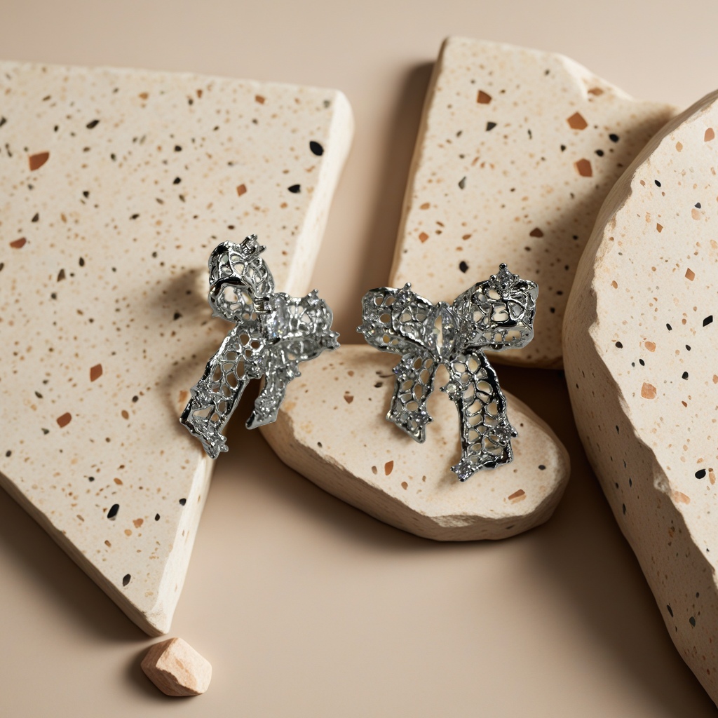 Silver hollowed-out bow stud earrings are fashionable, simple and versatile earrings