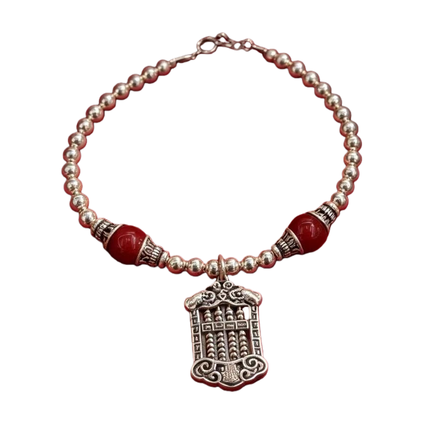 A silver necklace in a red velvet box Item Picture