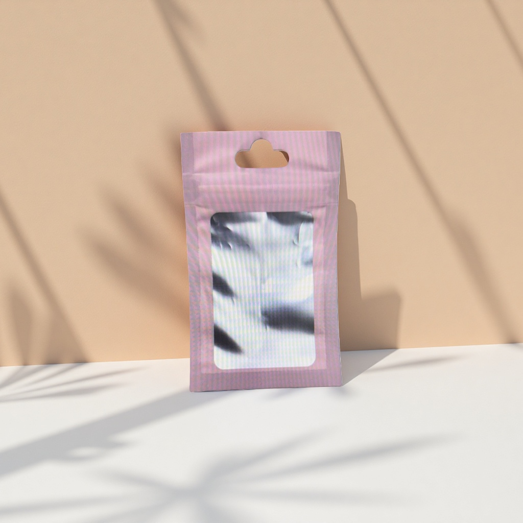 The pink perforated packaging bag contains a fashionable and portable storage bag with silver reflective items