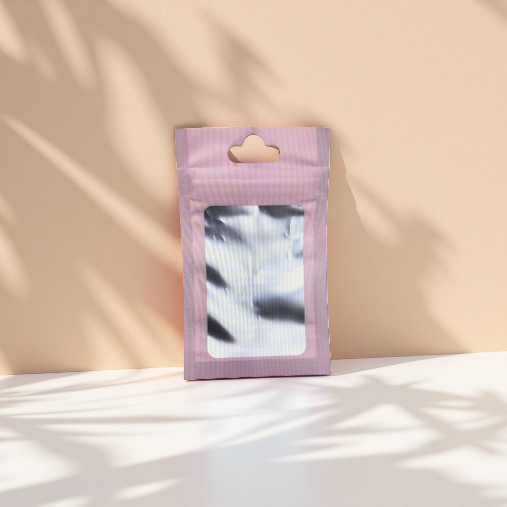 The pink perforated packaging bag contains a fashionable and portable storage bag with silver reflective items details Picture