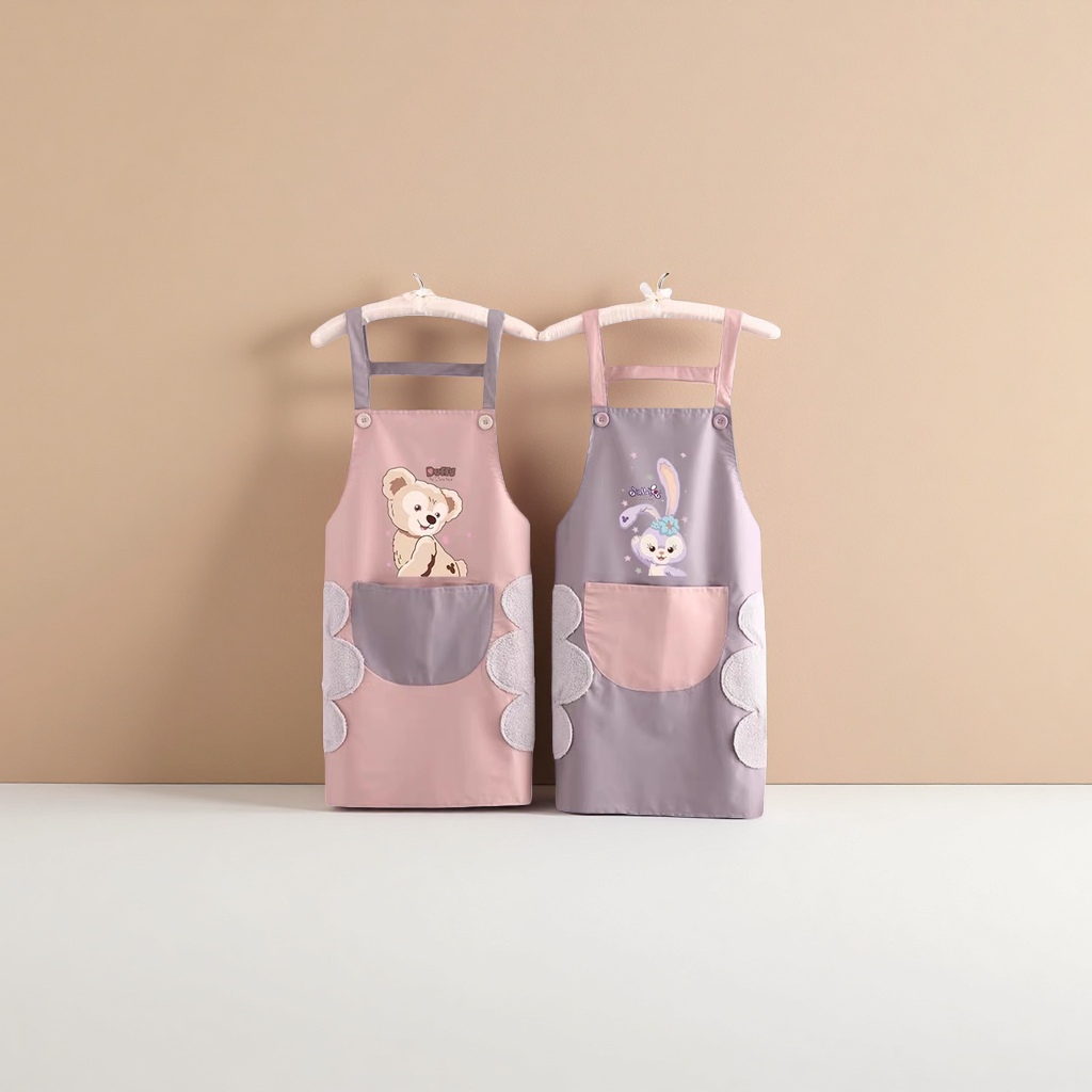 A pink and grey cartoon apron with a teddy on the left and a rabbit on the right, and double pockets with plush decoration Application Scenario