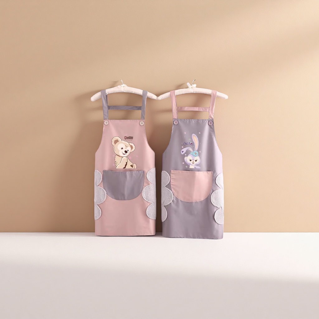 A pink and grey cartoon apron with a teddy on the left and a rabbit on the right, and double pockets with plush decoration details Picture