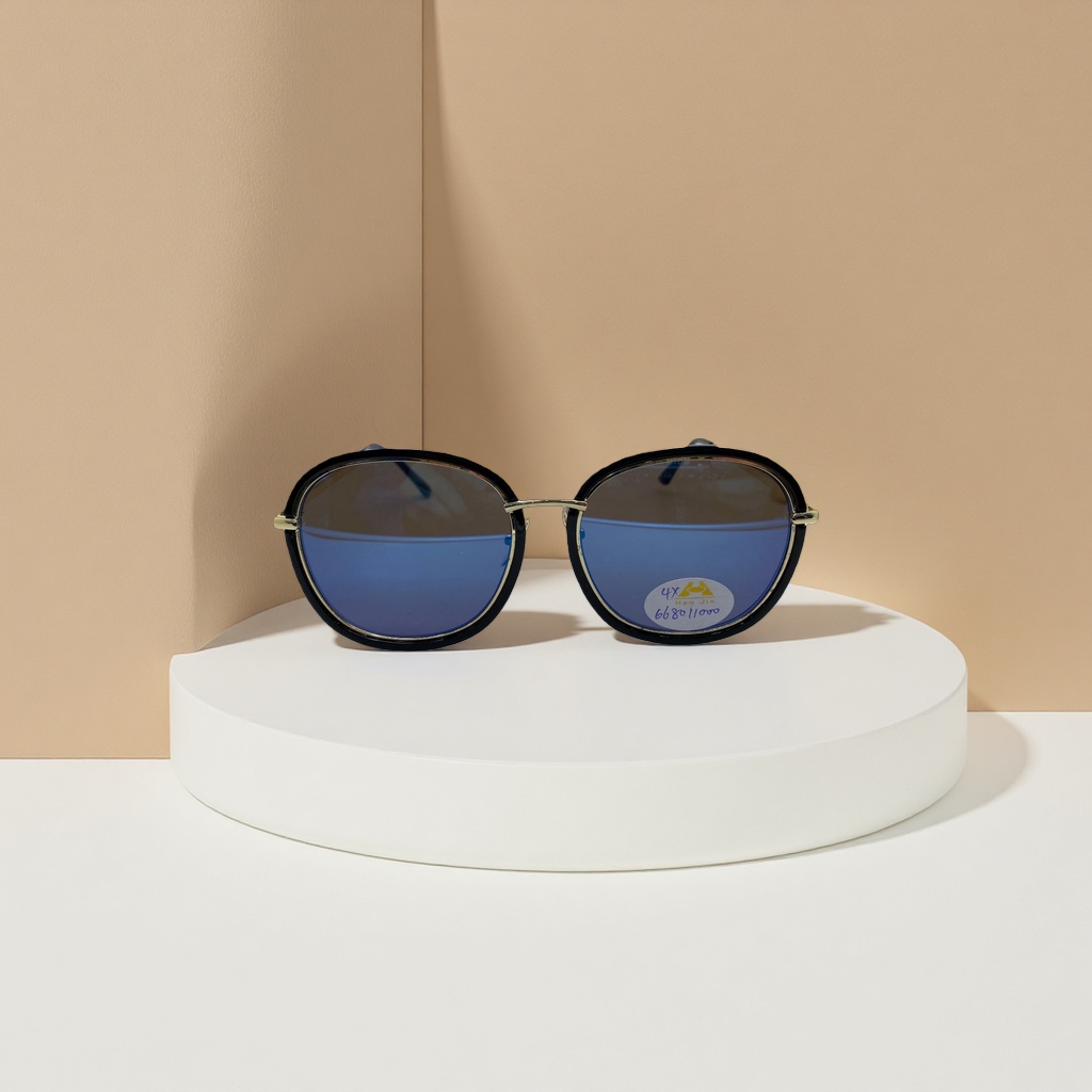 Sunglasses with black borders, thin gold frames and blue gradient lenses