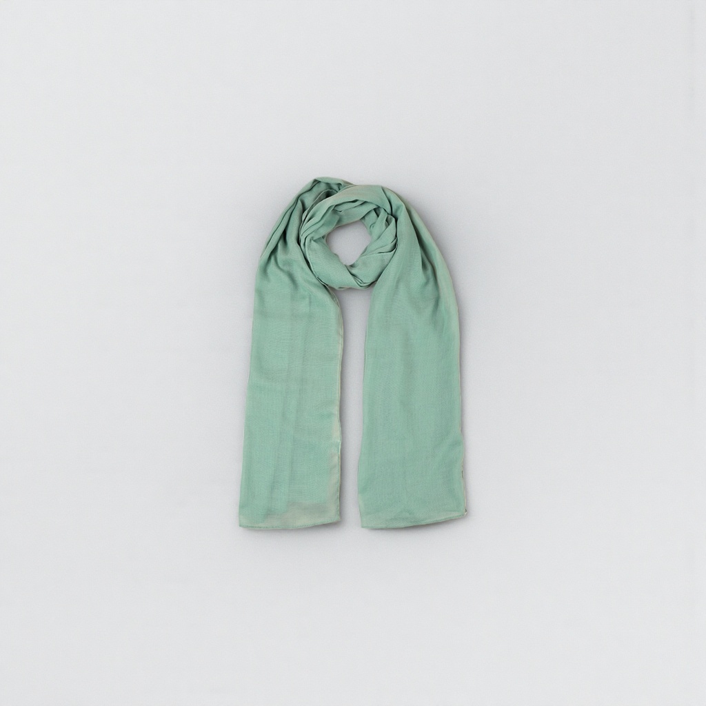 A light green velvet scarf is a luxurious and retro style that makes your skin look fairer when paired with a coat