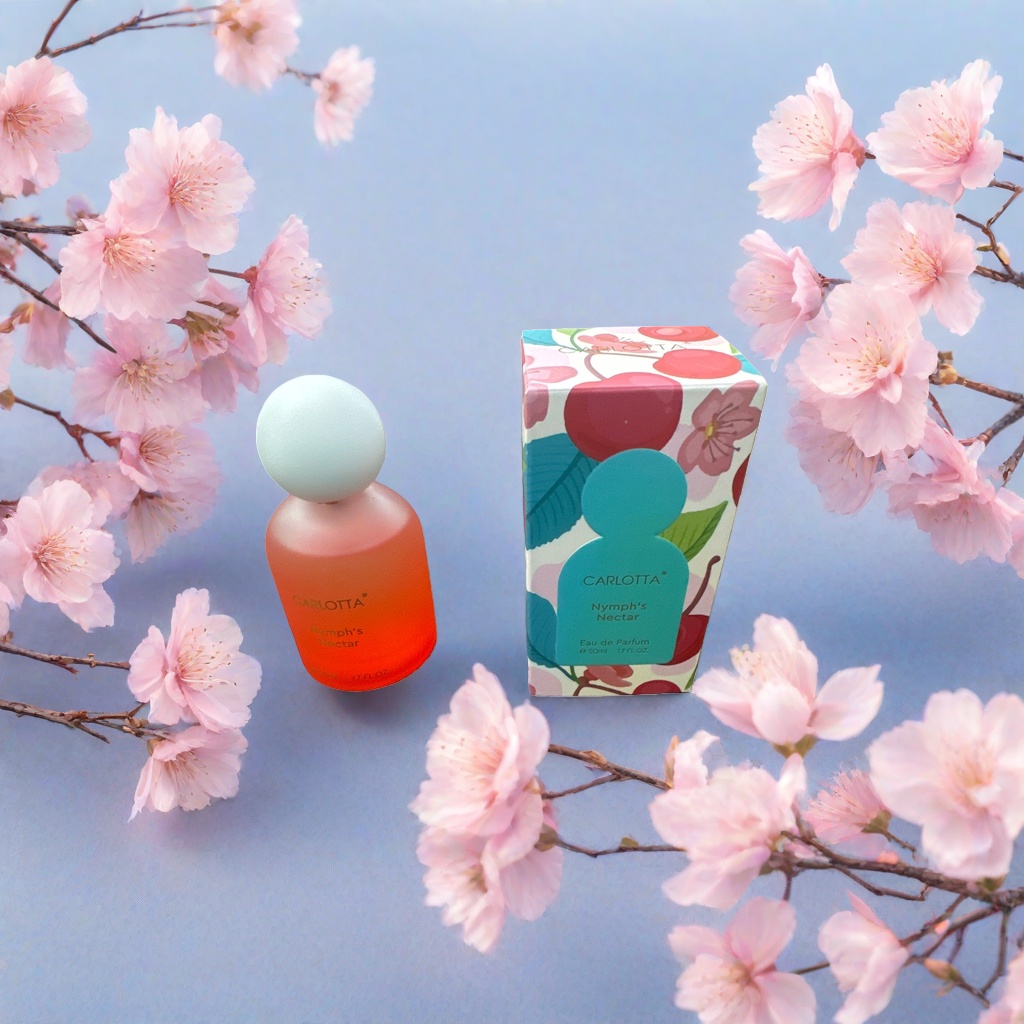 橙红色渐变瓶身配白色球形瓶盖的香水，彩色樱桃花卉图案包装盒产品图