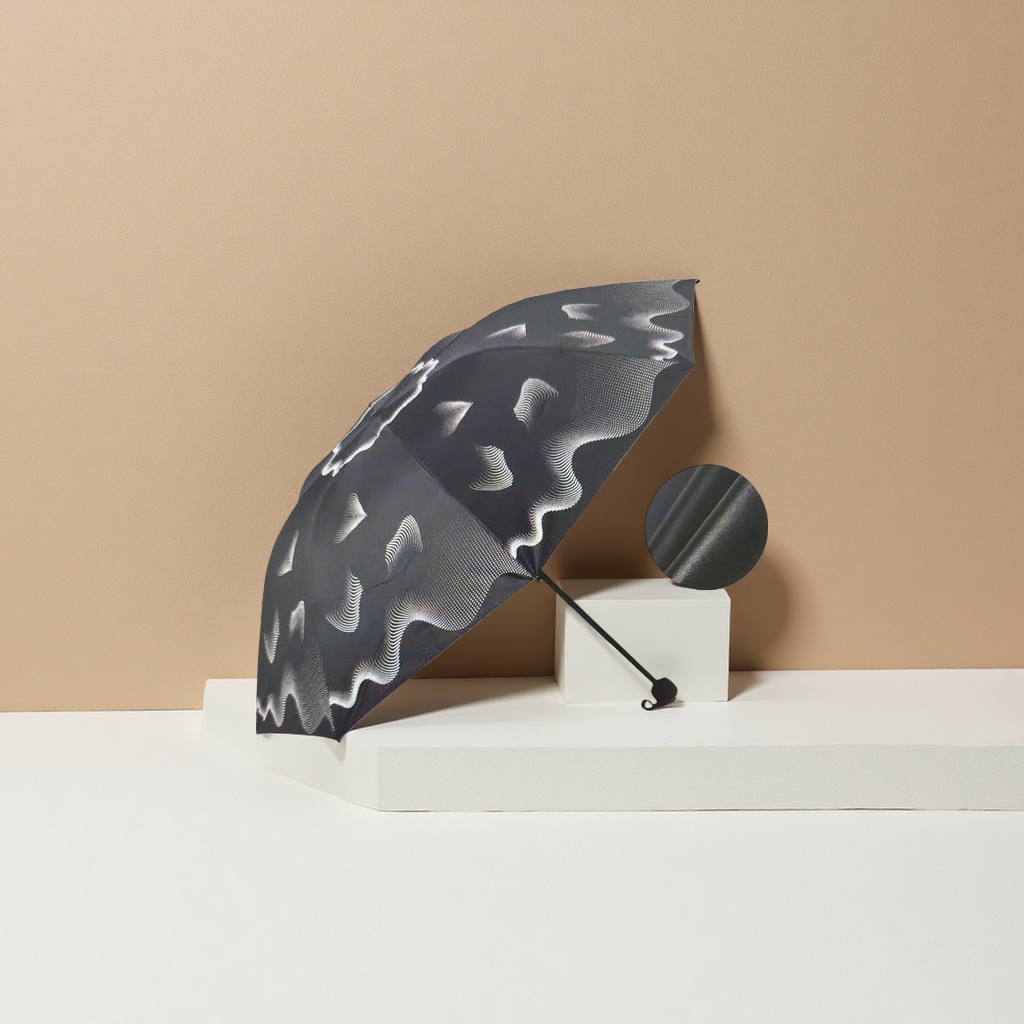 The black wavy pattern all-weather umbrella is waterproof, sun-proof, sunshade and foldable for portability