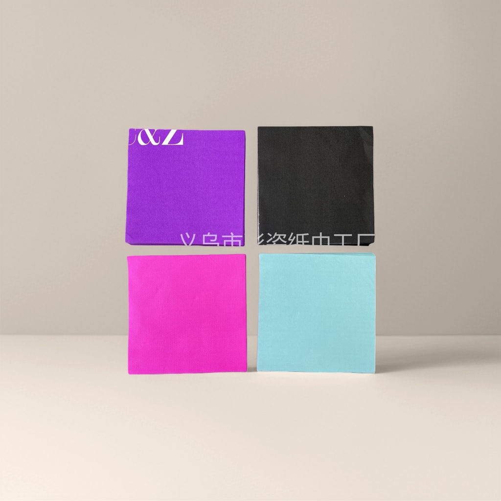 Four stacks of colored tissues, each in purple, black, pink and light blue Four stacks of colored tissues, each in purple, black, pink and light blue