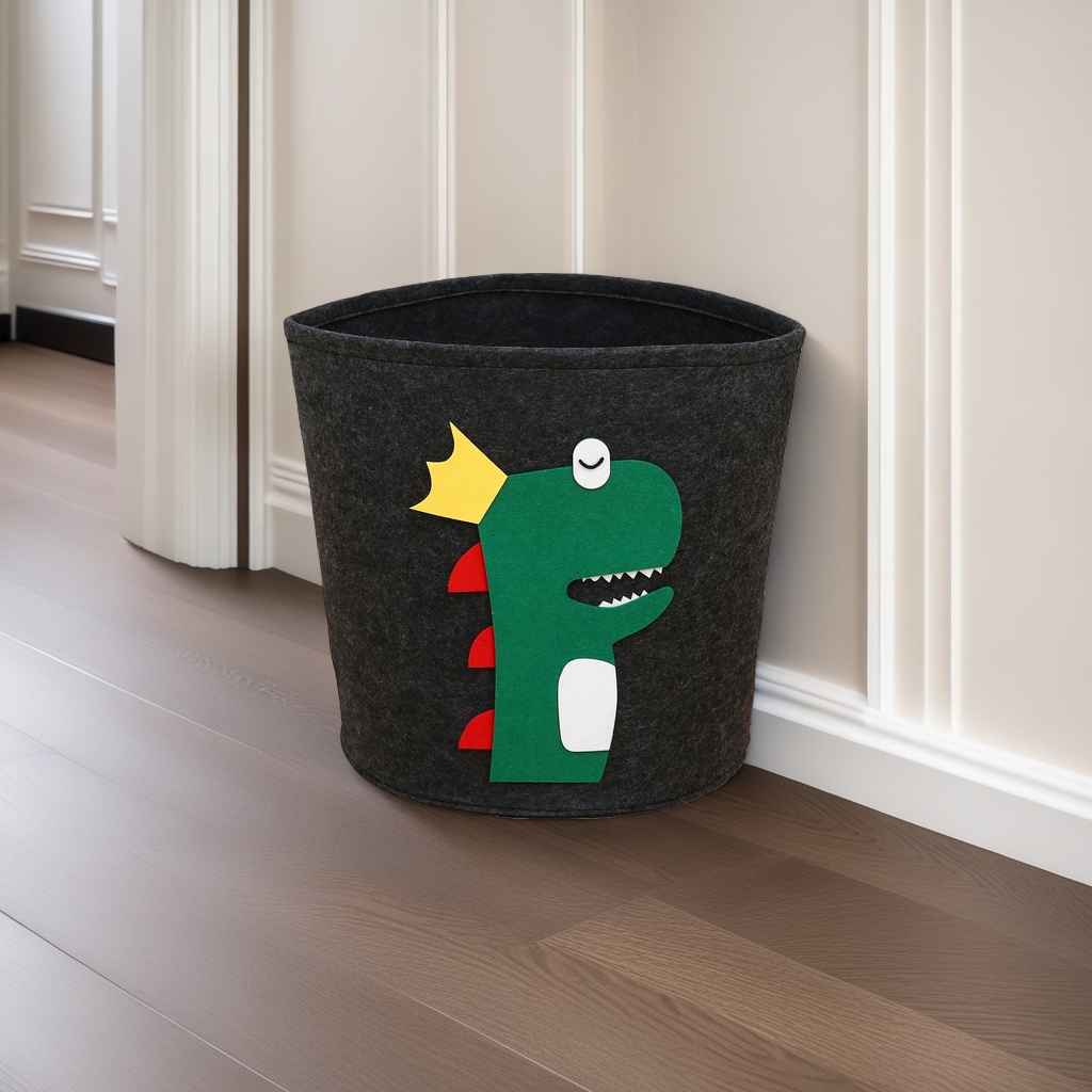 Black felt storage bucket, green cartoon dinosaur pattern, yellow crown, red dorsal fin, white abdomen, single eye smiling Specification image