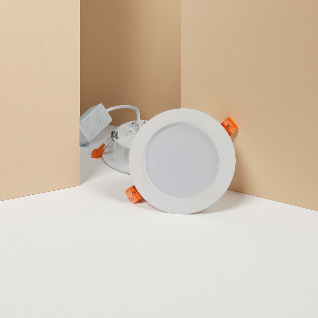 White circular LED downlight strip with orange clips and white driver power supply