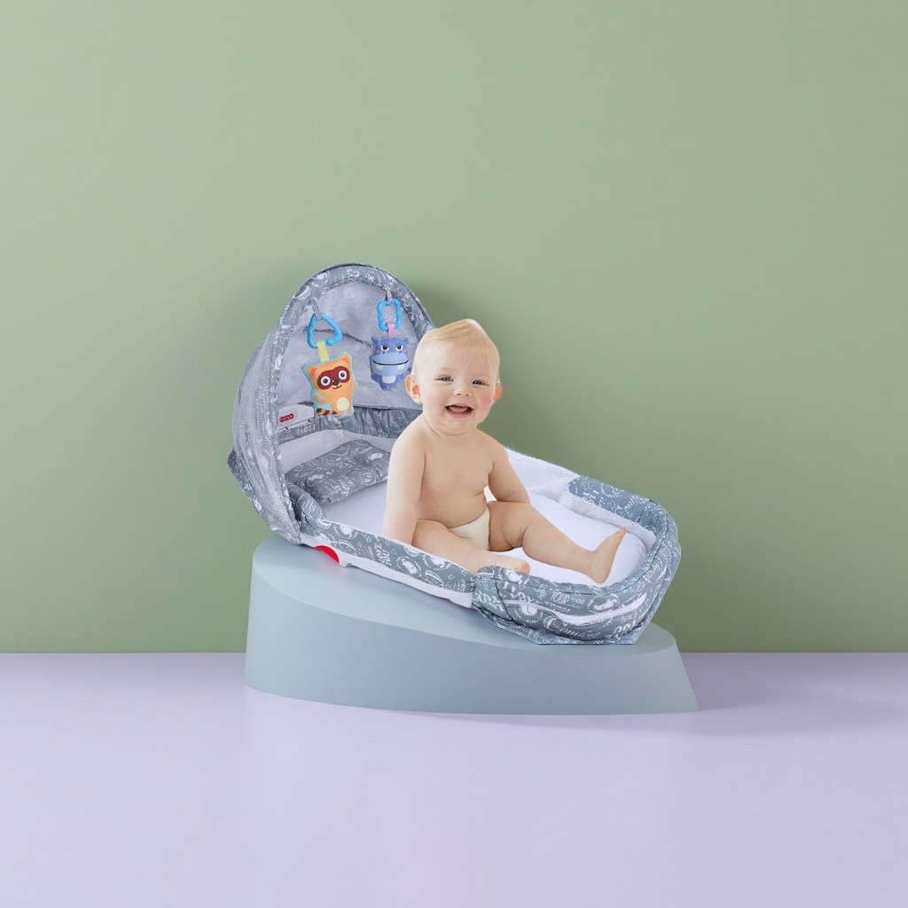 The grey portable folding crib with a built-in smiling baby pattern is lightweight and easy to store Specification image