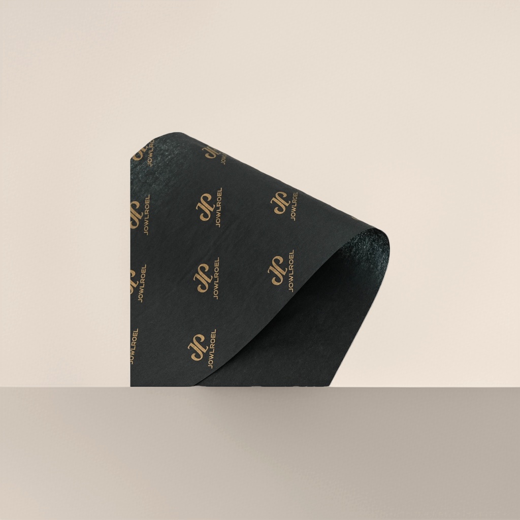 黑色卷状纸张 印有金色JOWLROEL品牌标识