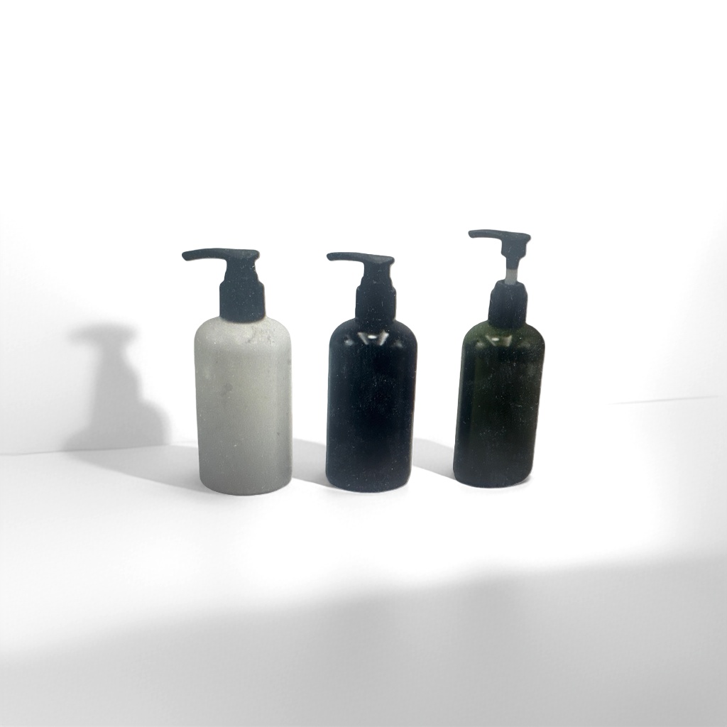 Three-bottle press-type container, with matte white, black and green bottle bodies and black pump heads
