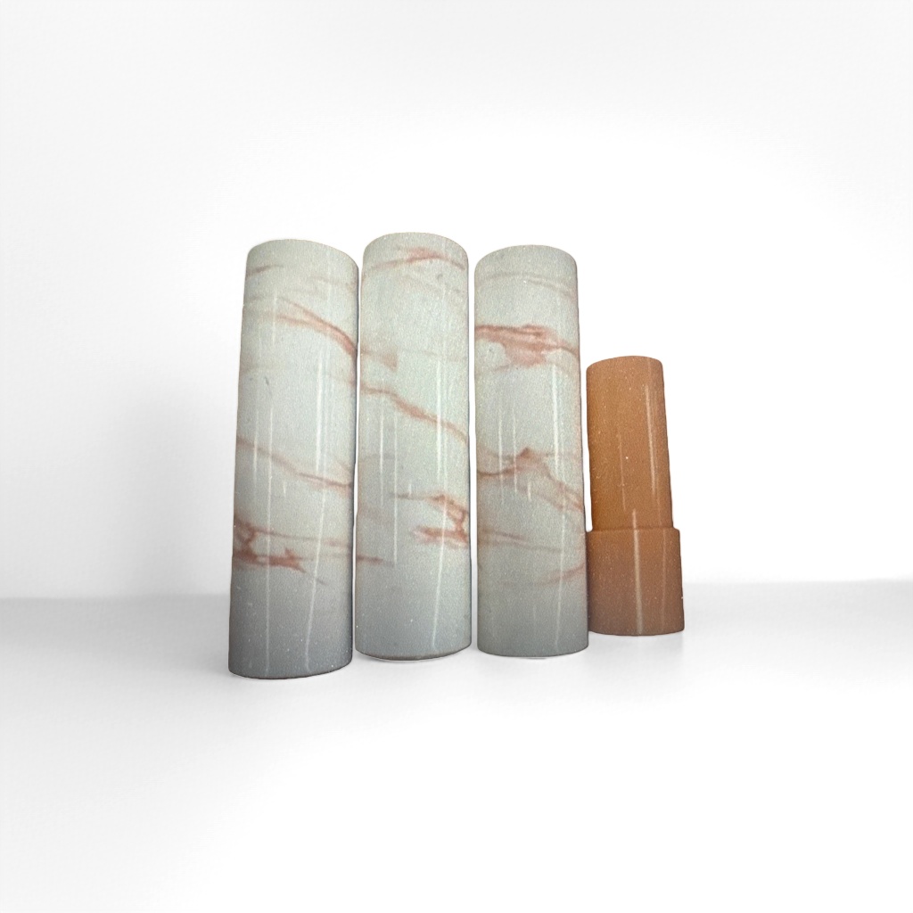 Four marble-patterned tubes are lined up side by side, with an orange tube body on the right side and a lid details Picture