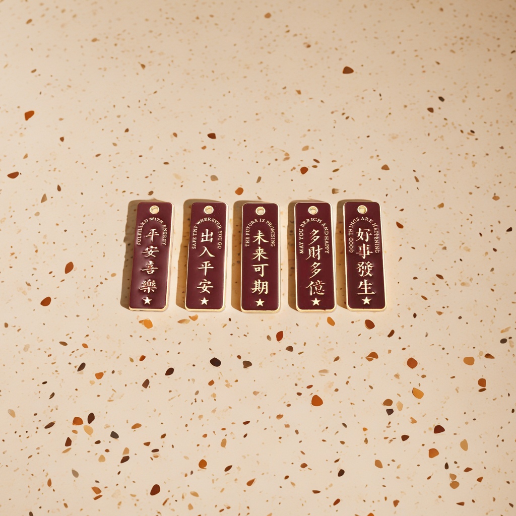 Five deep red bookmarks with golden Chinese and English blessings and round holes