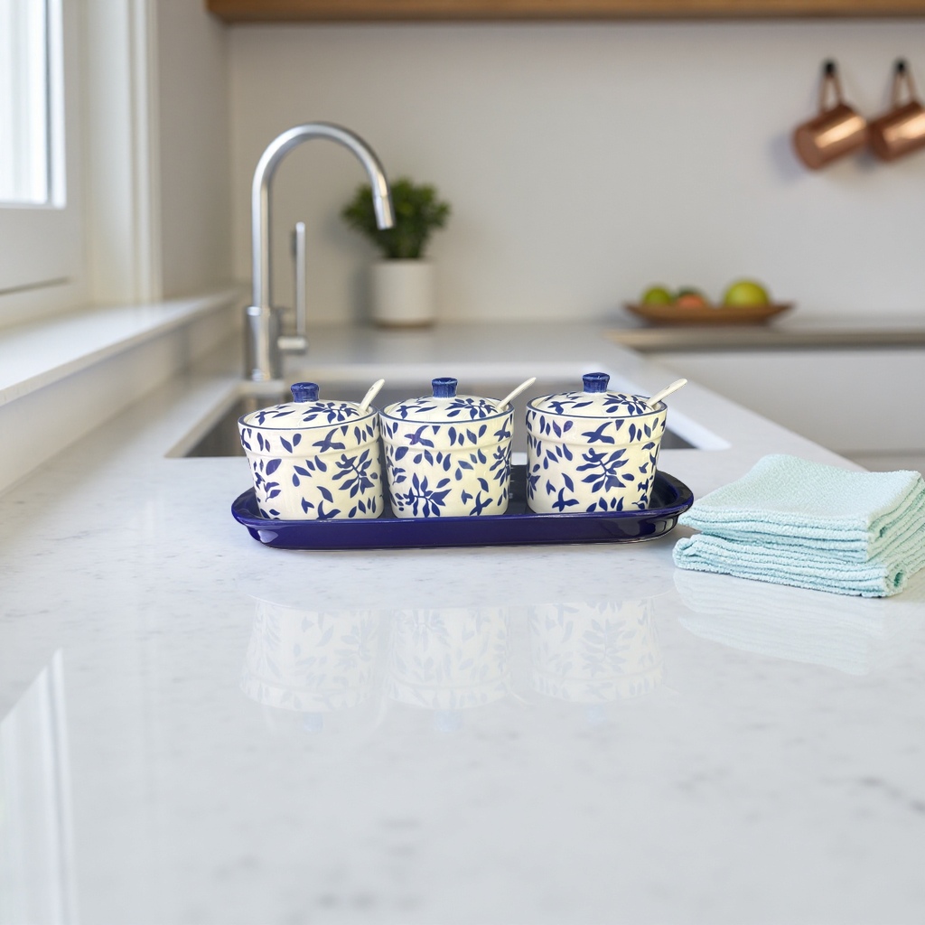 A three-piece set of blue and white leaf-patterned ceramic seasoning jars with a blue tray details Picture
