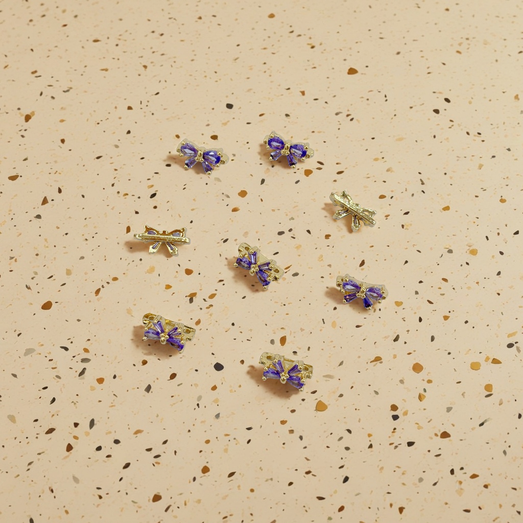 A golden bow decorative piece set with purple gemstones, a fashionable and handcrafted accessory Specification image