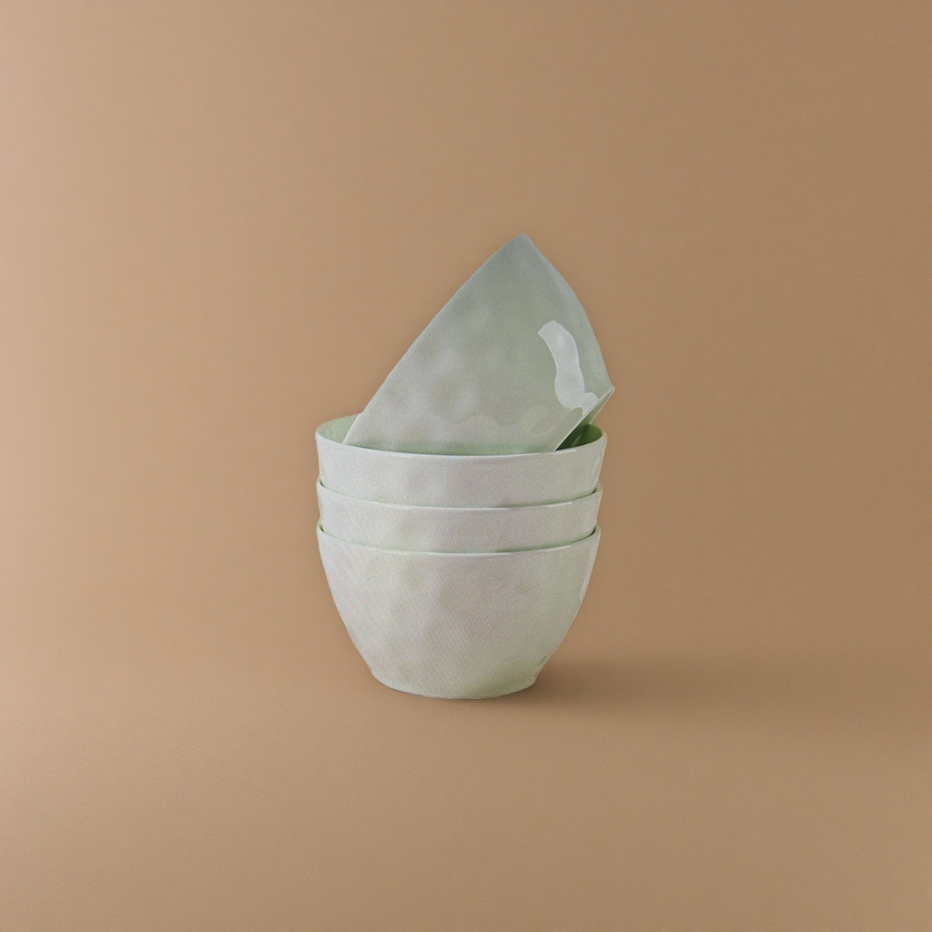 The light green ceramic bowl set can be stacked for kitchen tableware, featuring a simple and elegant home style Application Scenario