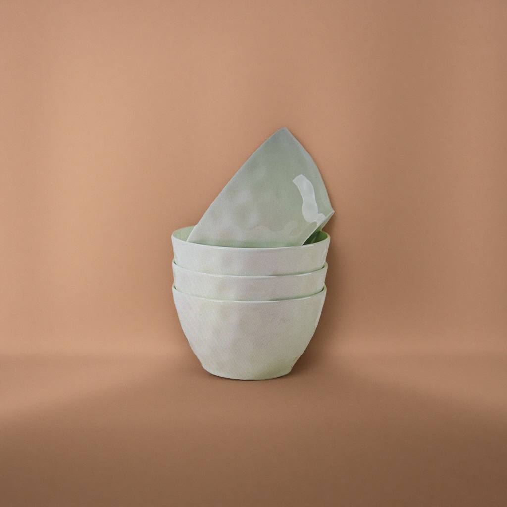 The light green ceramic bowl set can be stacked for kitchen tableware, featuring a simple and elegant home style details Picture