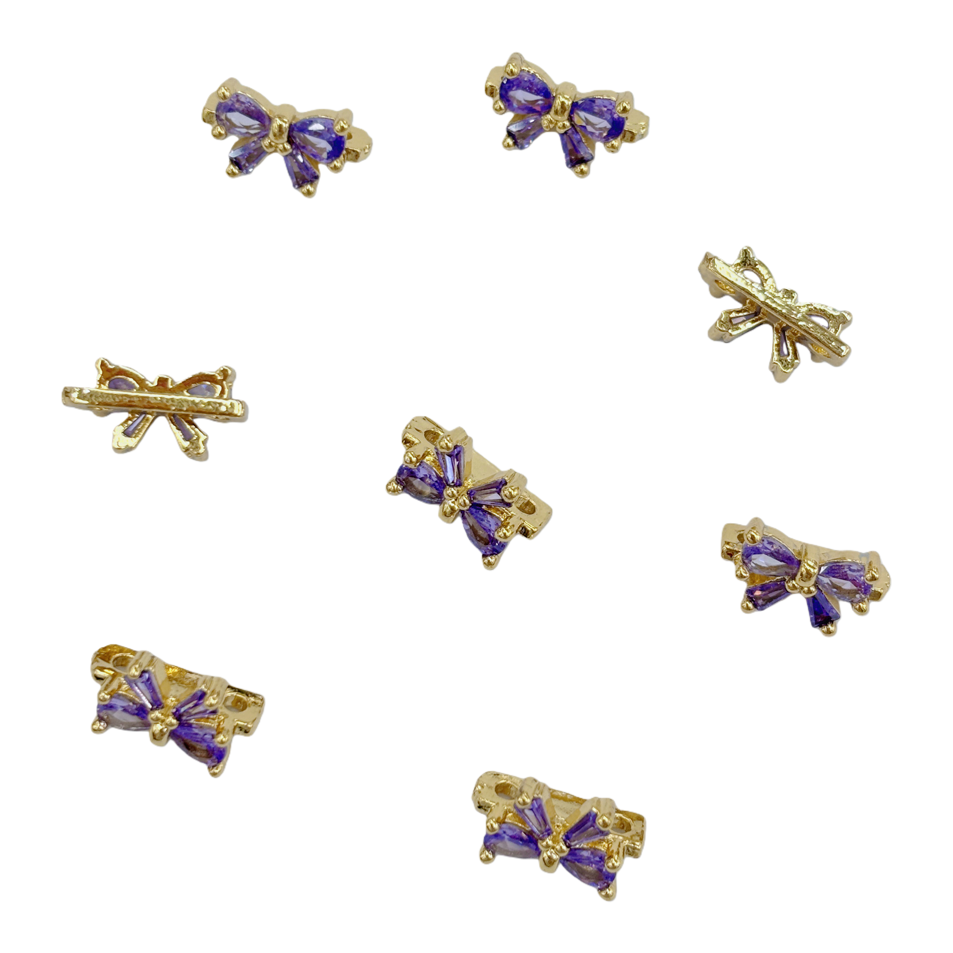 A golden bow decorative piece set with purple gemstones, a fashionable and handcrafted accessory Item Picture
