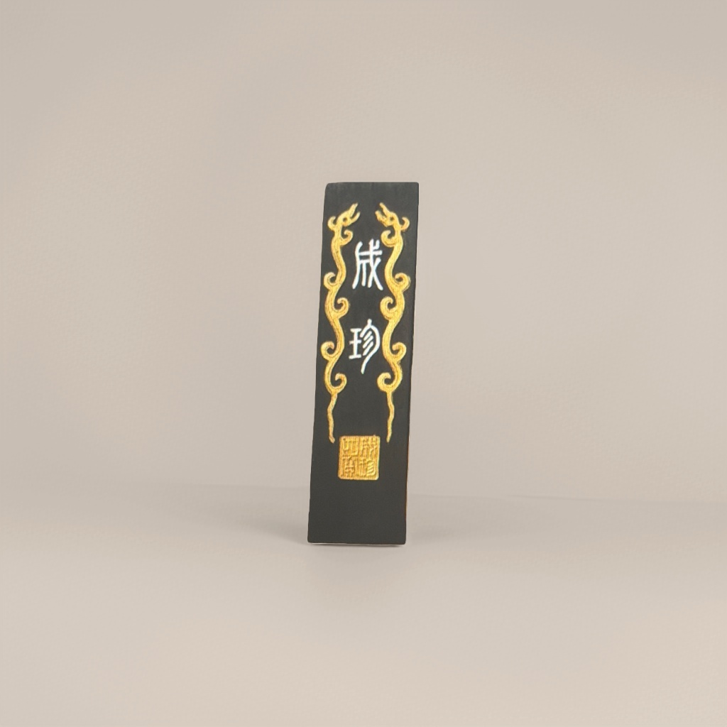 The surface of Chengzhen's black long strip-shaped ink ingot is decorated with golden dragon patterns and seals details Picture