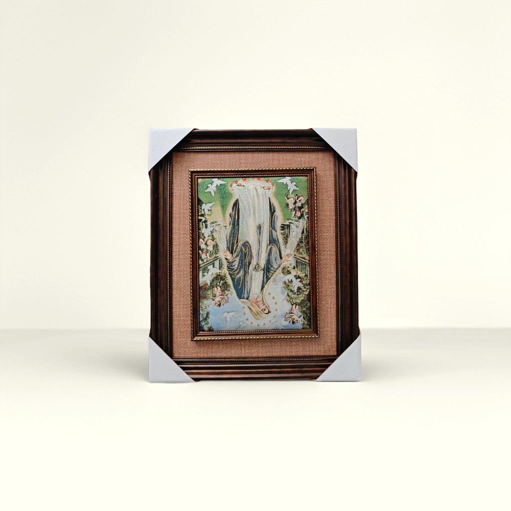 A dark brown carved picture frame tapestry with a decorative painting of the Virgin Mary on the wall details Picture