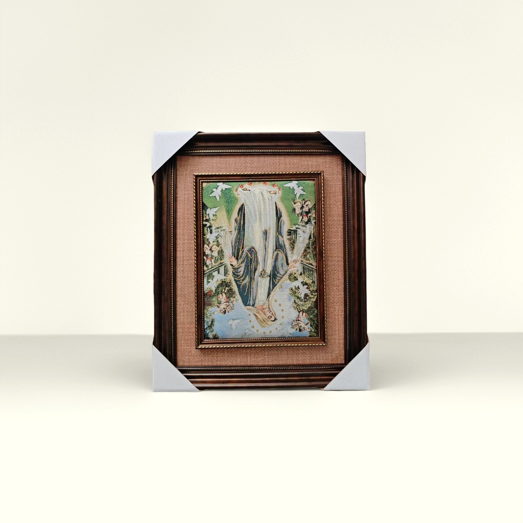 A dark brown carved picture frame tapestry with a decorative painting of the Virgin Mary on the wall