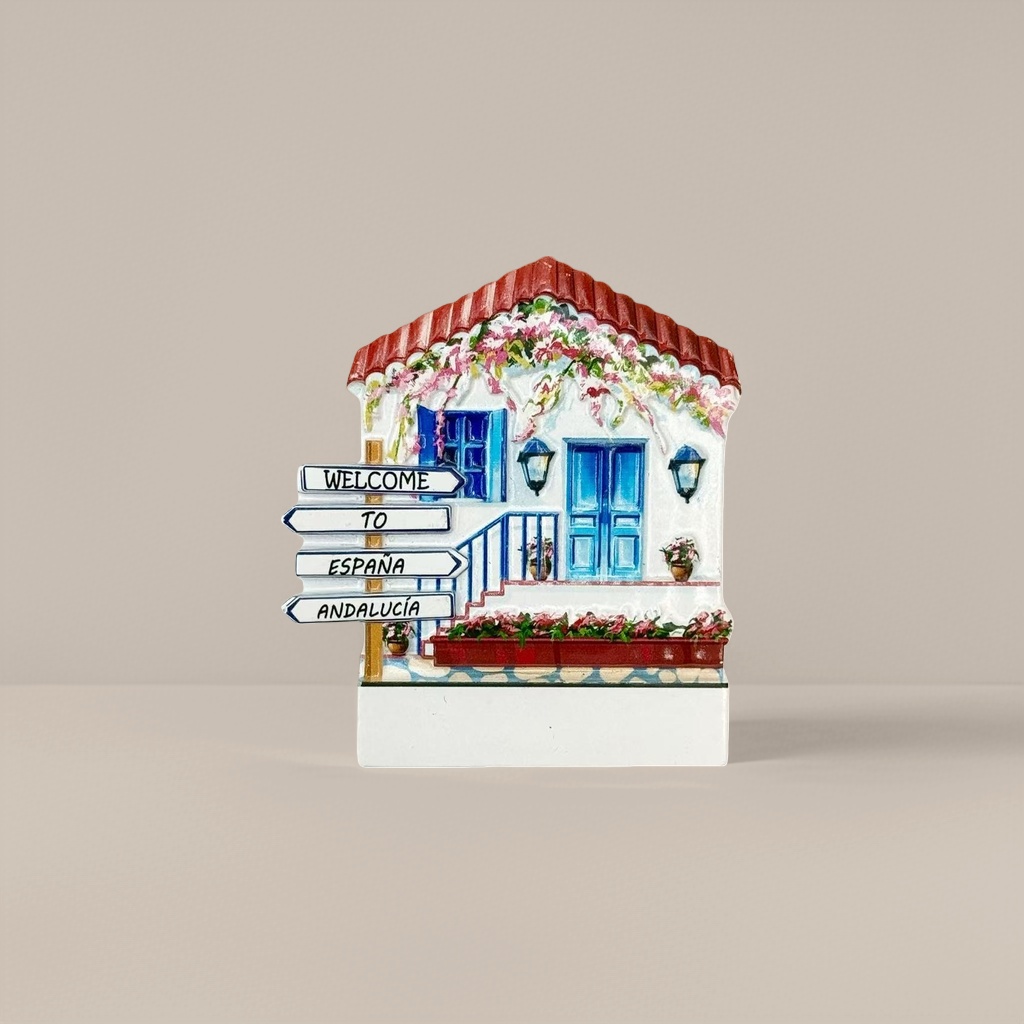 Colorful house-shaped fridge magnets, blue doors and Windows, red roof, floral decorations, WELCOME TO ESPANA ANDALUCIA road signs
