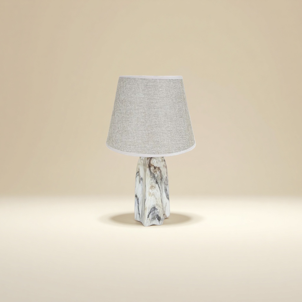 A beige fabric lampshade paired with a marble-patterned lamp base table lamp details Picture