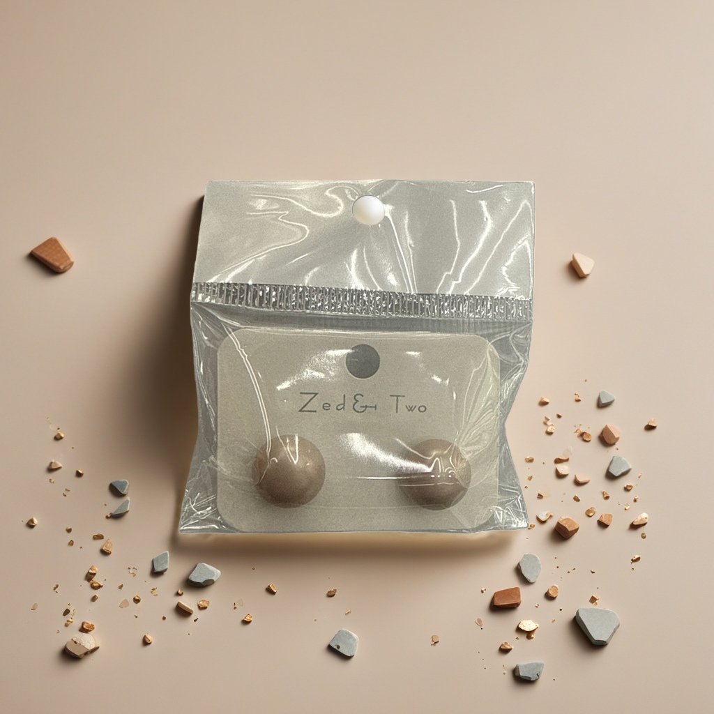 Zed & Two beige ear studs are packaged in transparent plastic bags with brand labels details Picture