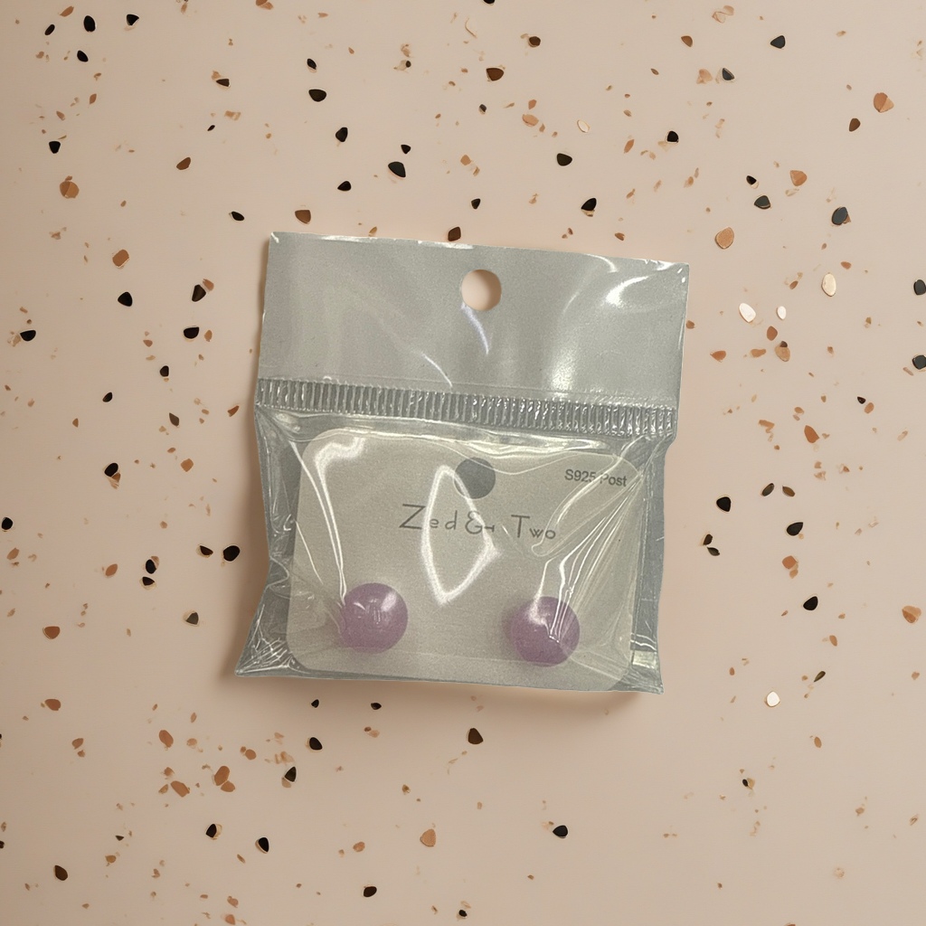 Zed & Two purple round stud earrings are packaged in transparent plastic bags Specification image