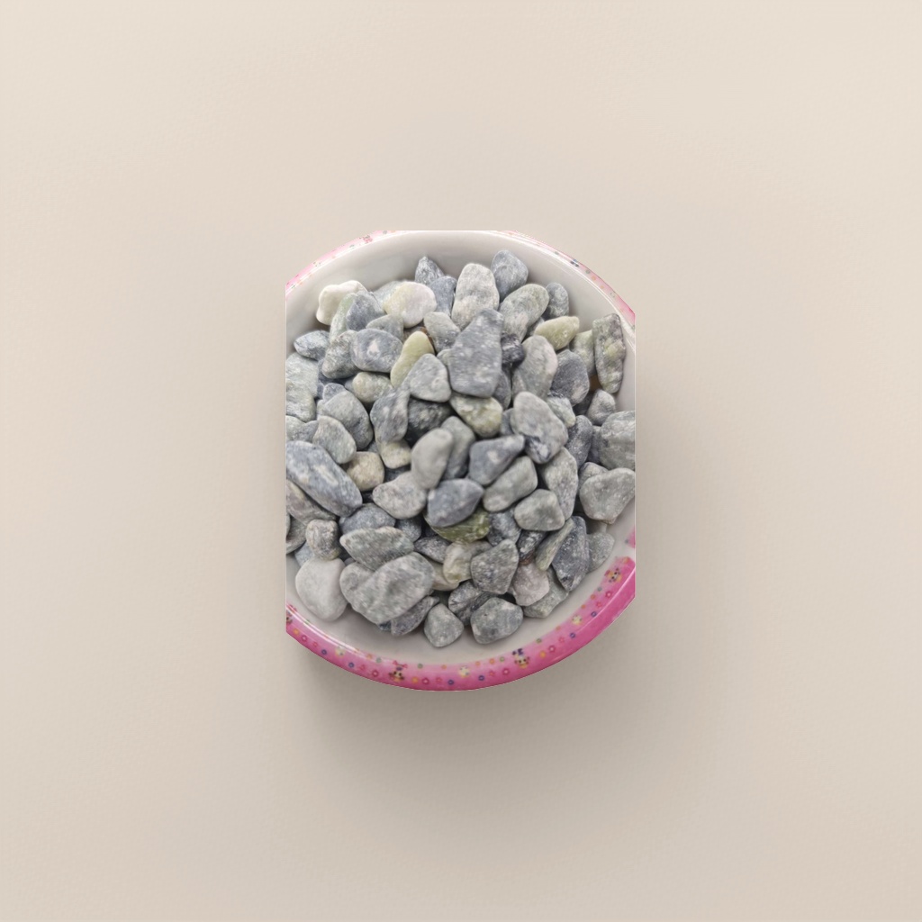 A home decoration piece featuring a ceramic bowl decorated with grey and green pebbles in a colorful lace bowl Application Scenario