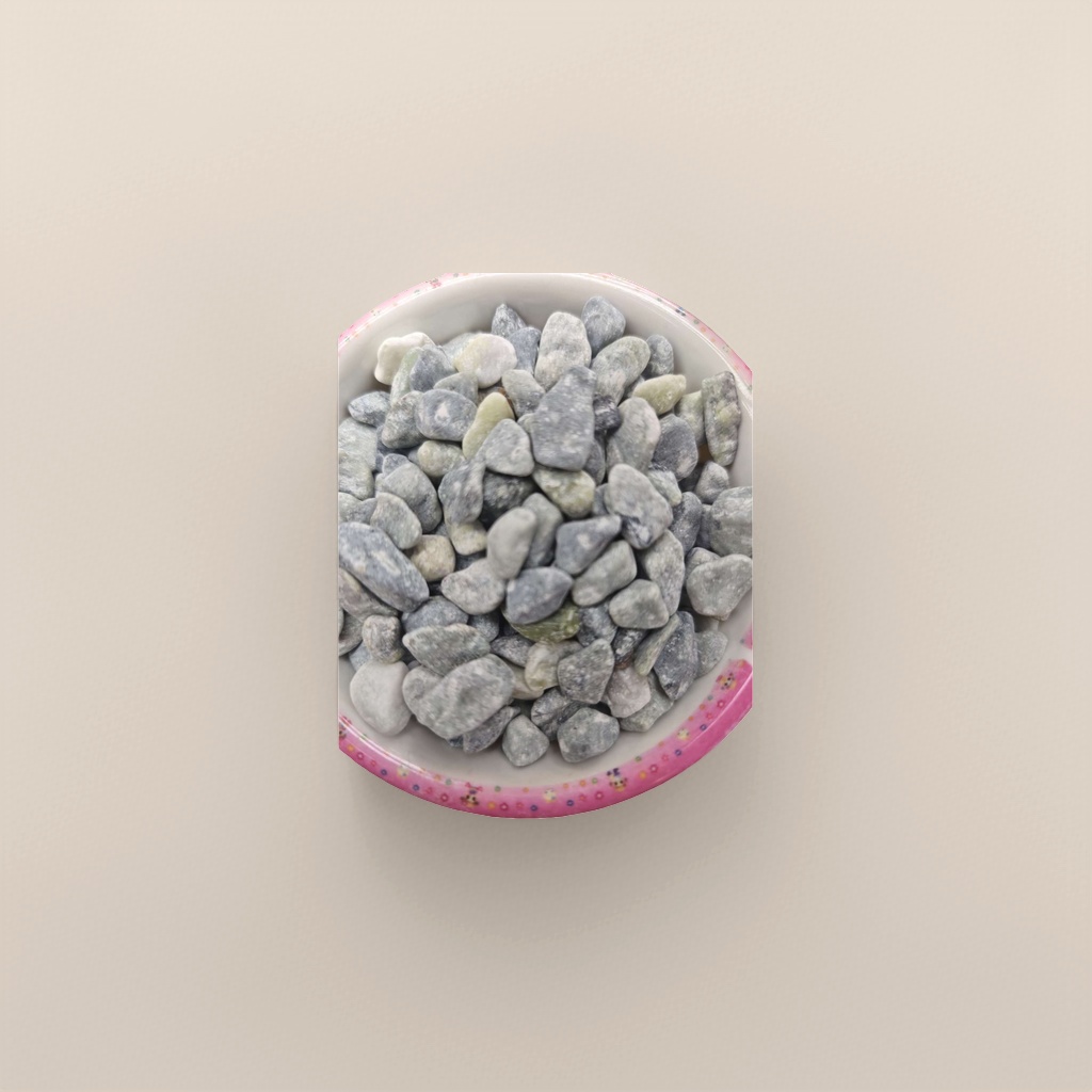 A home decoration piece featuring a ceramic bowl decorated with grey and green pebbles in a colorful lace bowl details Picture