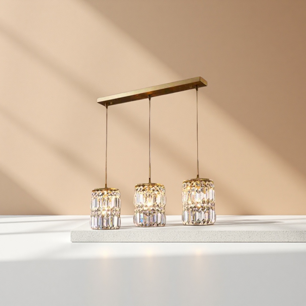 Three golden long crystal pendant chandeliers are ceiling-mounted living room and dining room lamps