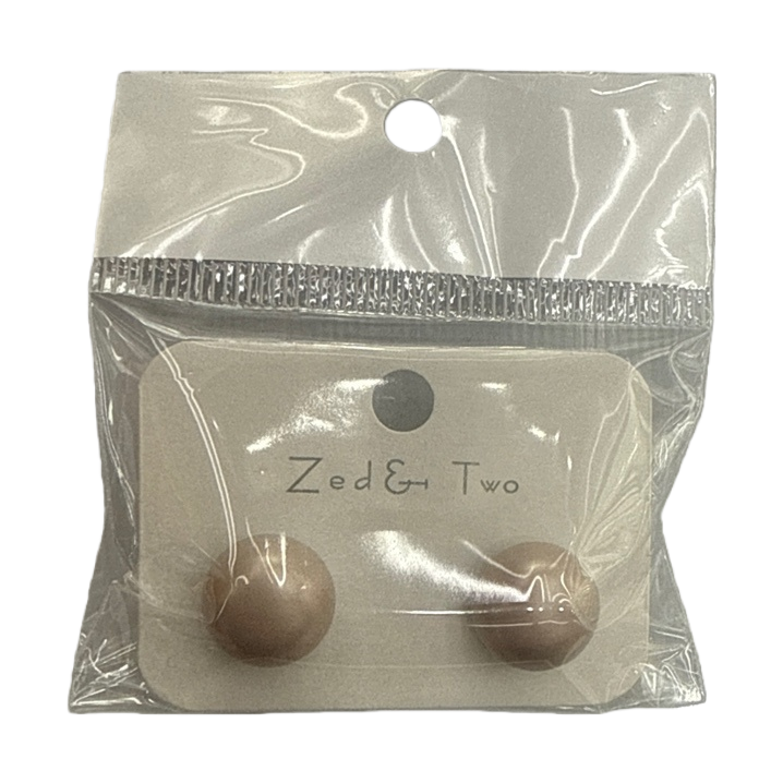 Zed & Two beige ear studs are packaged in transparent plastic bags with brand labels Item Picture