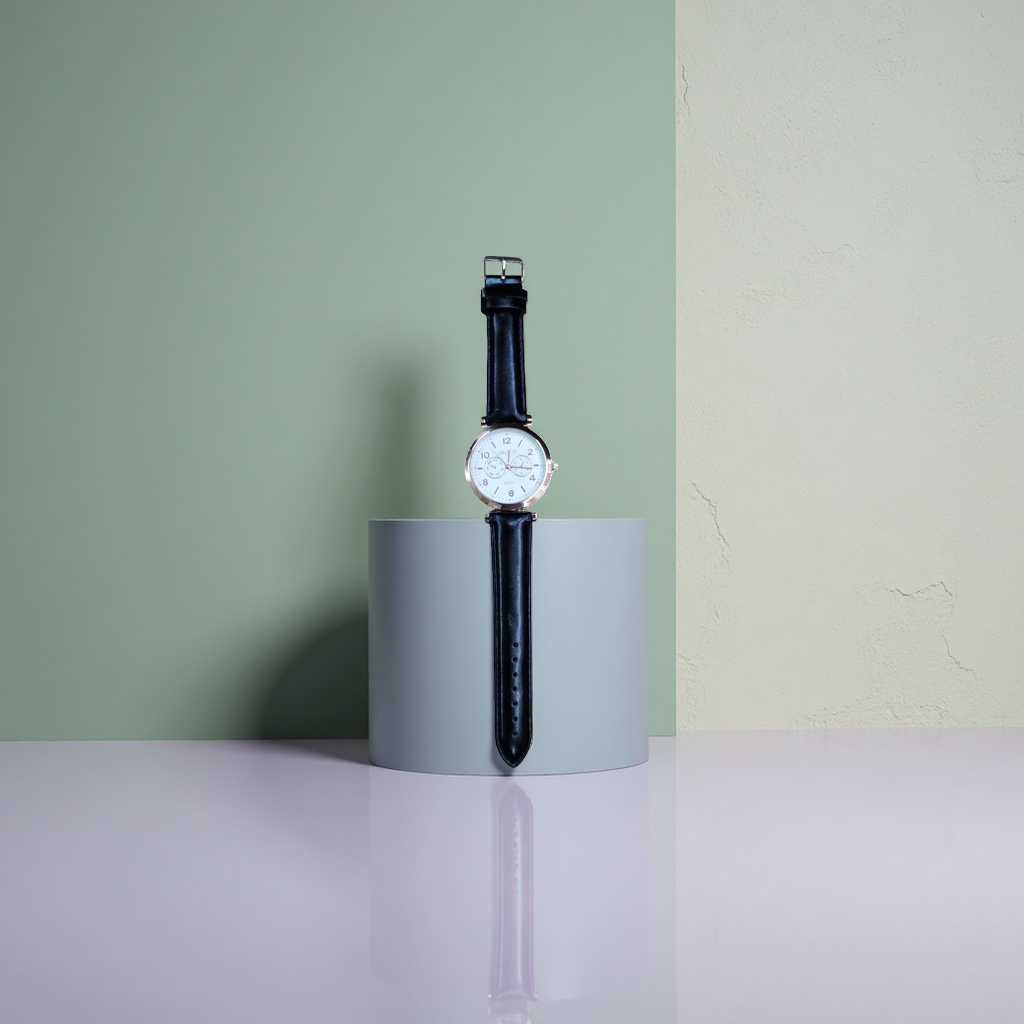 The OROVIP rose gold border white dial black leather strap watch with a wooden base is on display Application Scenario