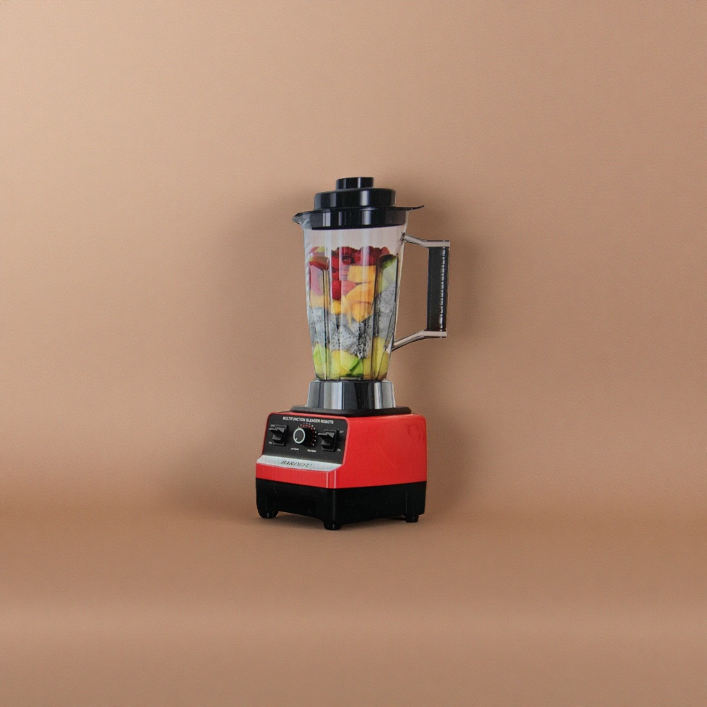 Mezclador negro con base roja con cuerpo transparente lleno de frutas