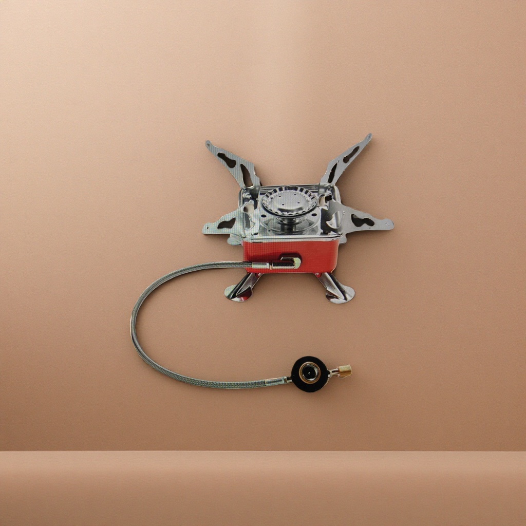 The red portable gas stove is equipped with a metal stand and a hose fitting