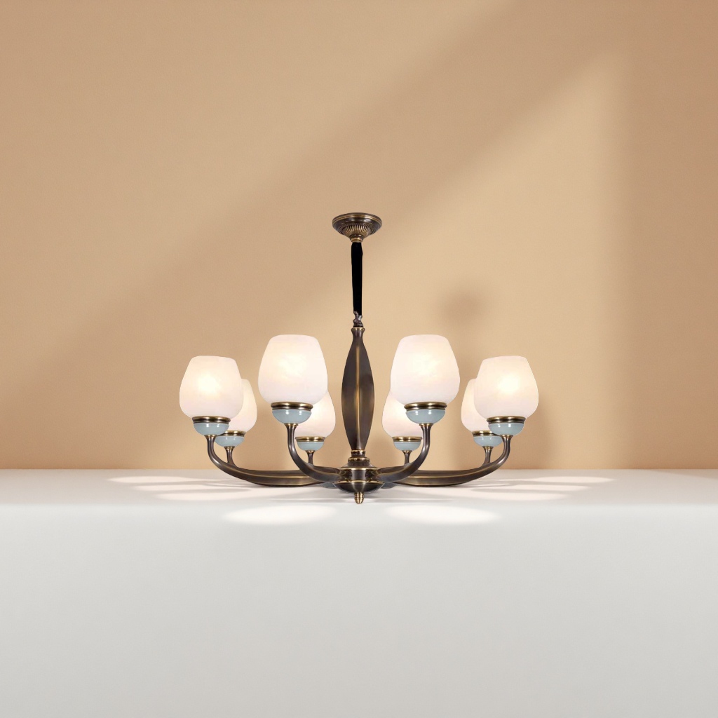 A bronze-colored chandelier with a milky white frosted glass lampshade and a light cyan base