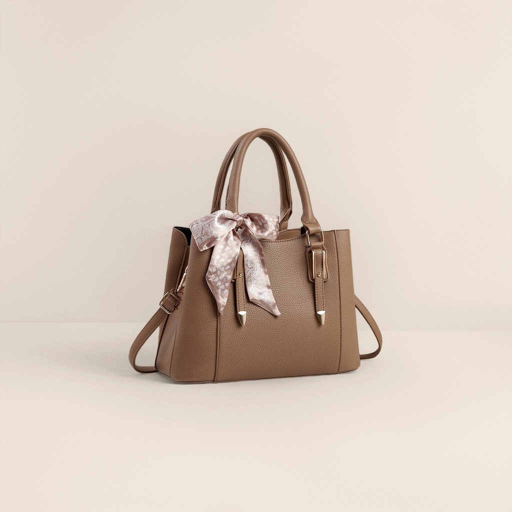 A fashionable commuting bag for women with a brown textured handbag and a white patterned silk scarf bow Application Scenario