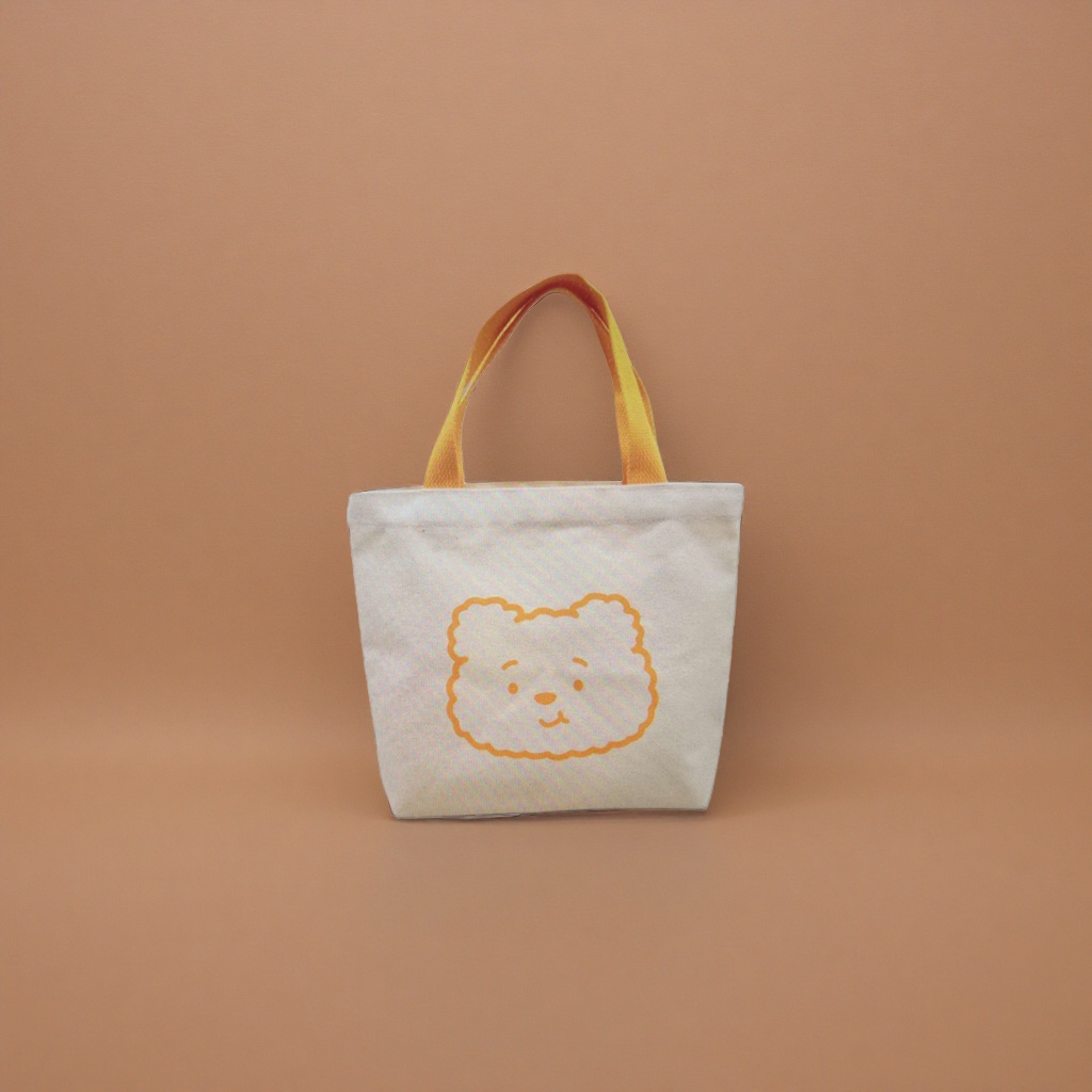 The white canvas bag and the orange bear pattern hand-held shopping bag are simple and versatile for daily commuting Application Scenario