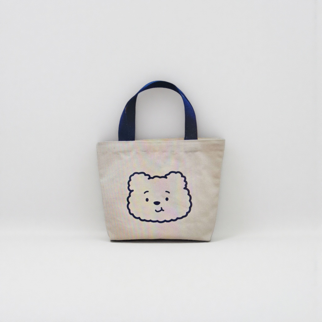 A simple and versatile handbag with a beige canvas bag featuring a cartoon bear face pattern Specification image